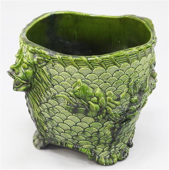 A large French green glazed pottery jardiniere, early 20th century, 62cm.